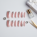 Crystal rhinestone press-on nails in almond shape with blush pink base